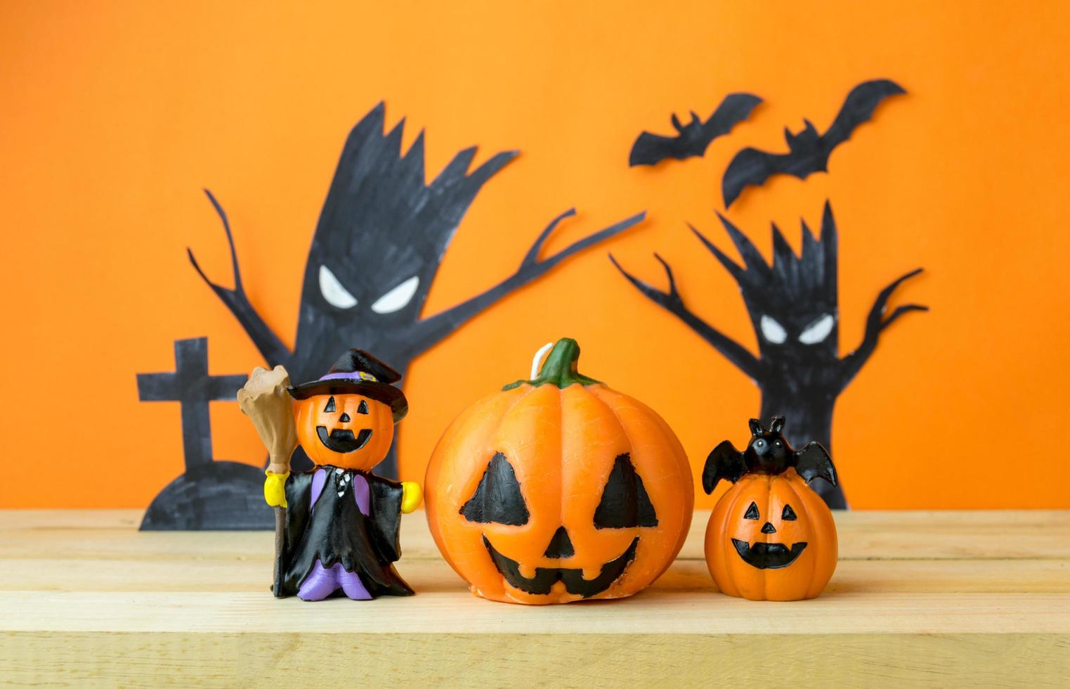 Halloween Pumpkins on wooden table photo