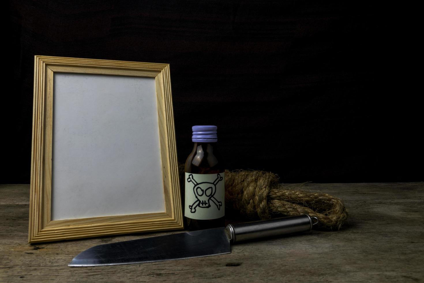 Picture frame and poison and knife. Concept Romance Suspense photo