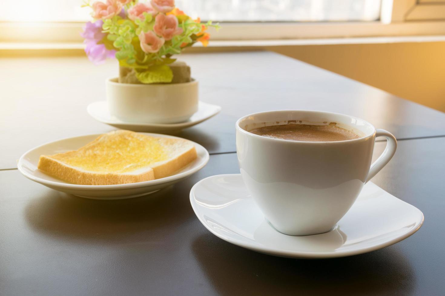 cup of coffee toast with butter. Morning light photo