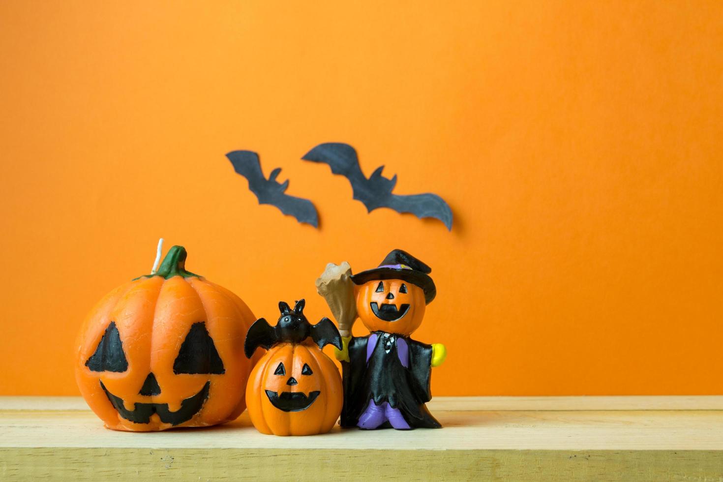 Halloween Pumpkins on wooden table photo