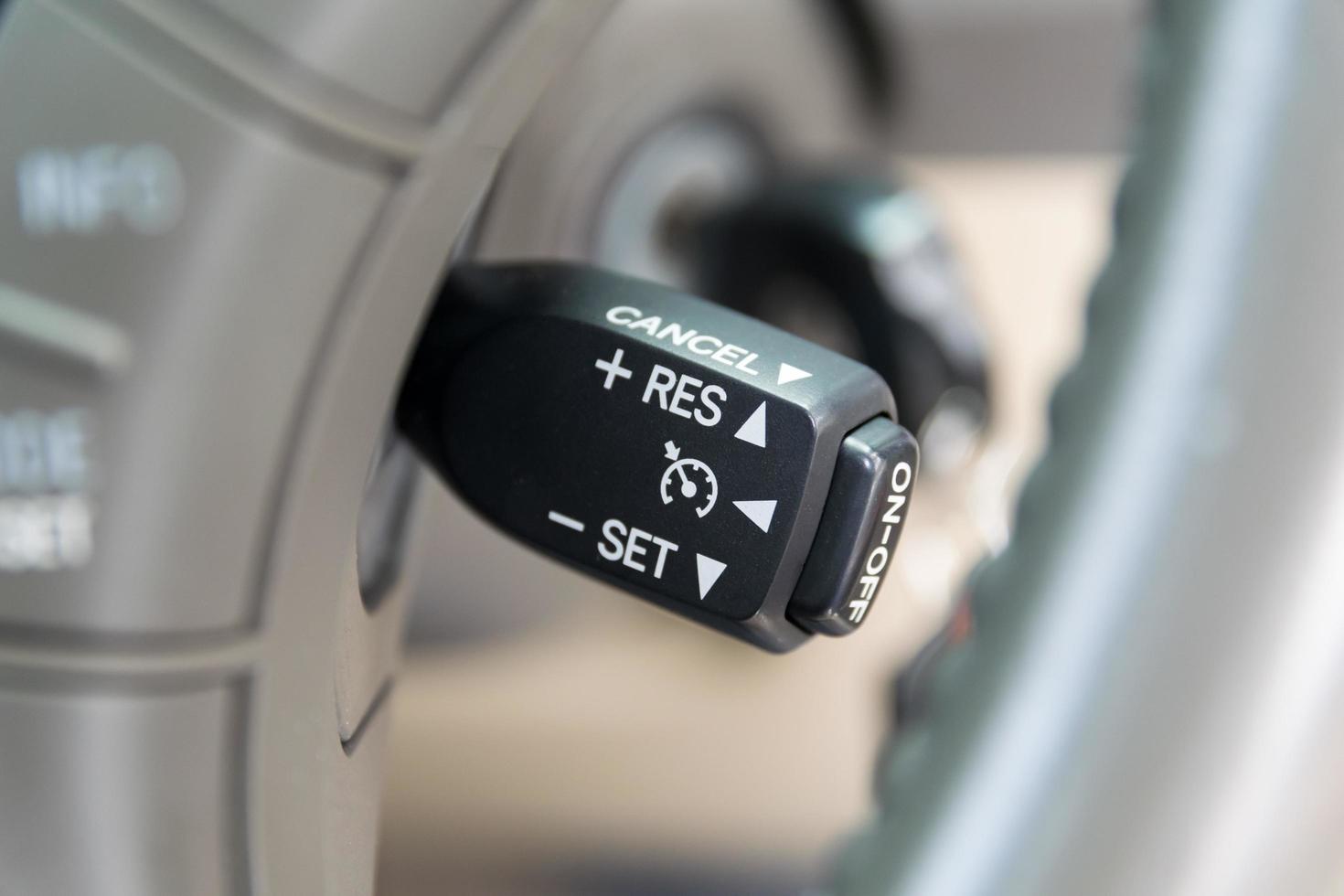 Cruise control buttons on modern car and speed limitation 7133303 Stock