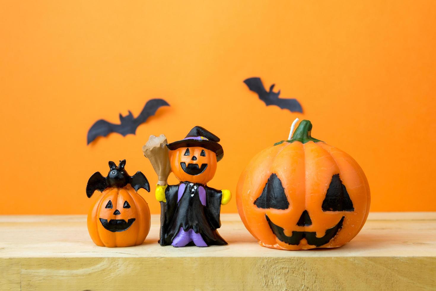 Halloween Pumpkins on wooden table photo