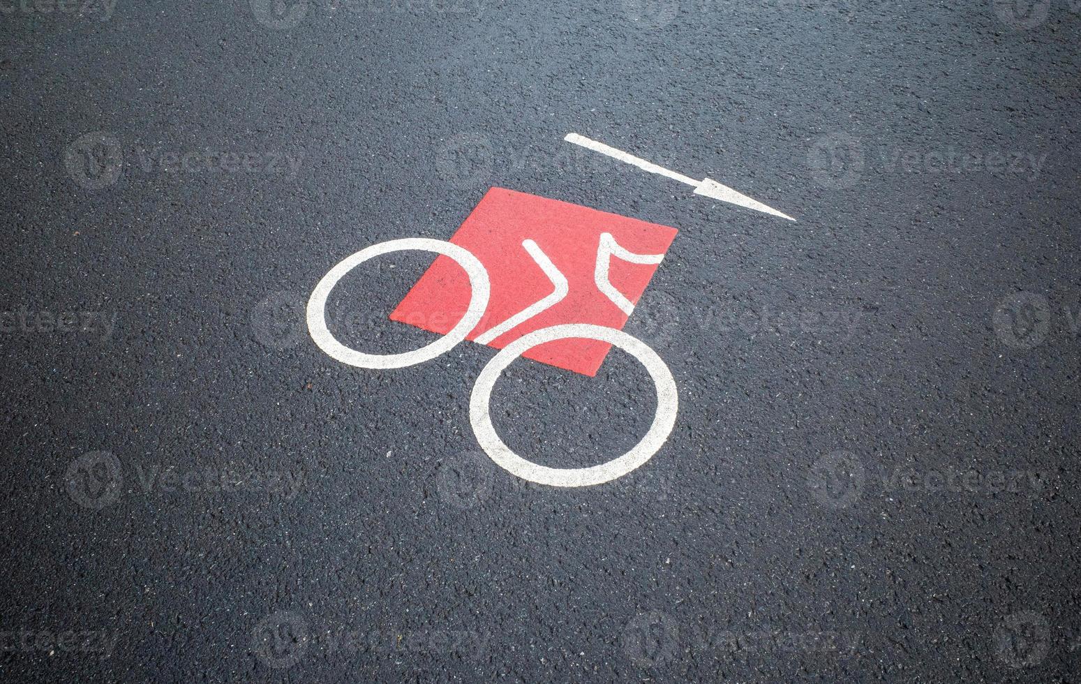 Road sign bike lane on asphalt photo