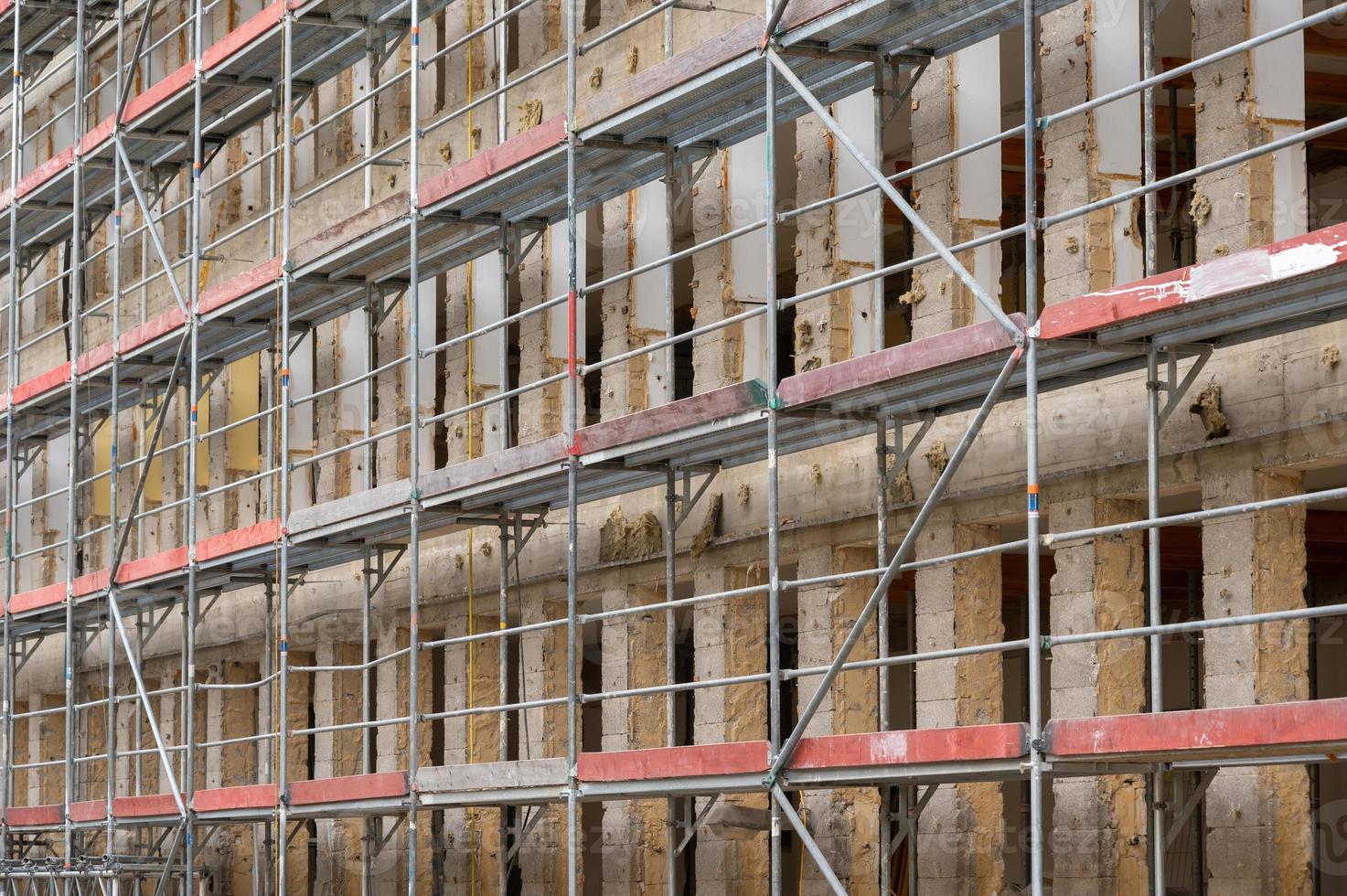 Construction site house with scaffolding photo