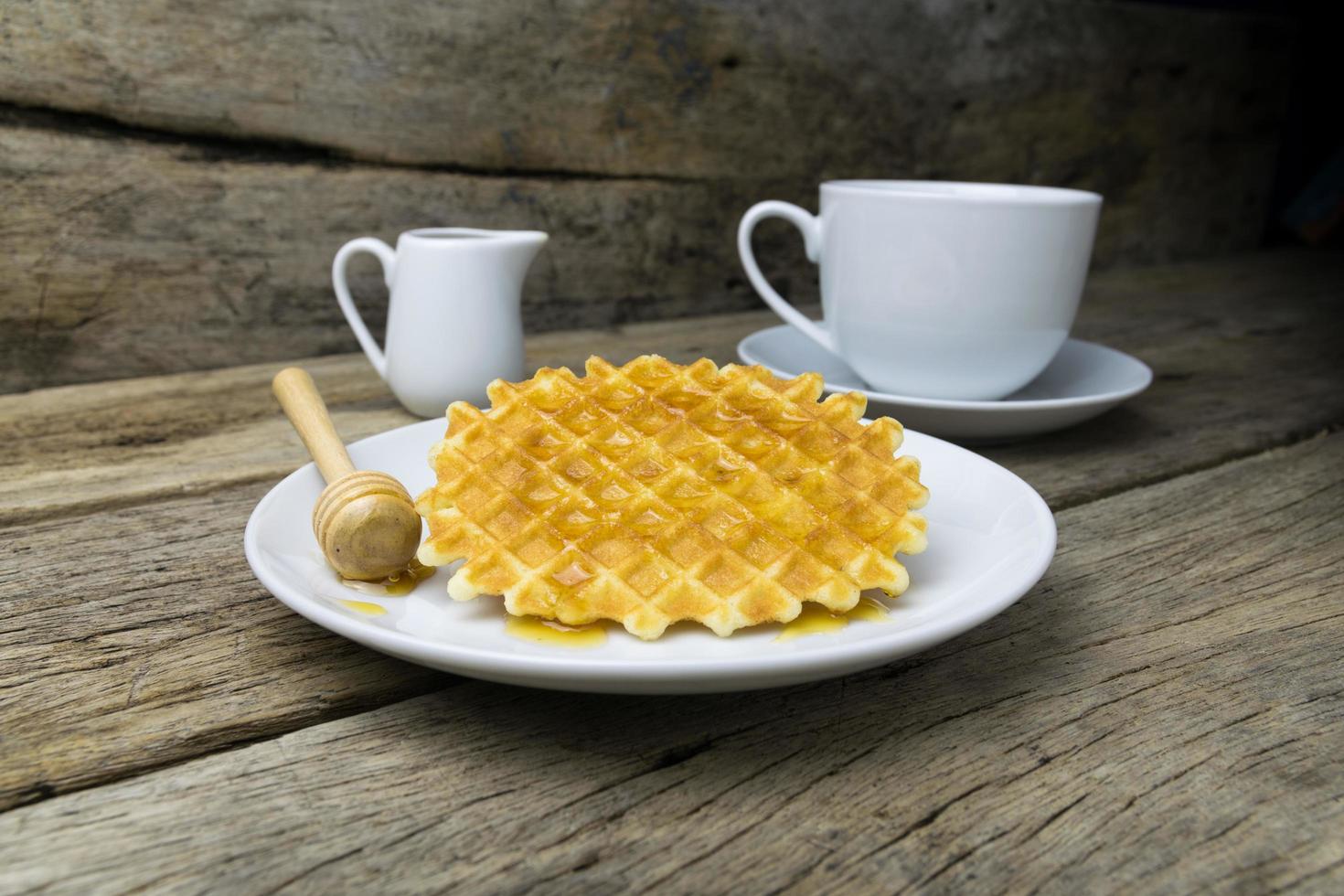 waffle with a cup of Coffee and honey photo