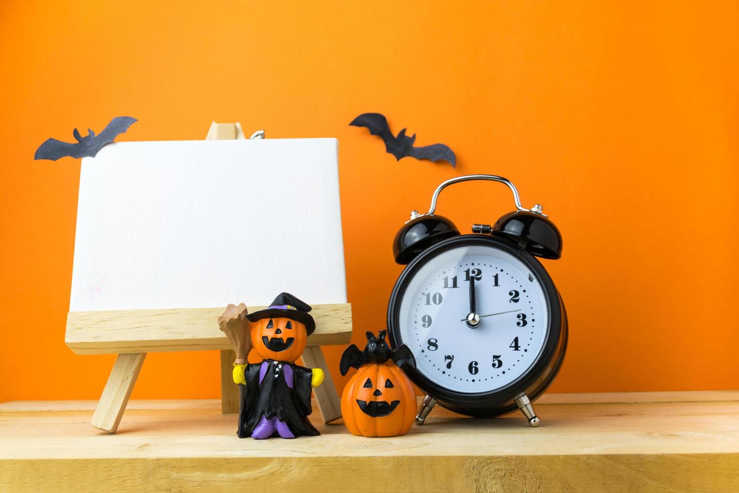 Halloween Pumpkins on wooden table photo