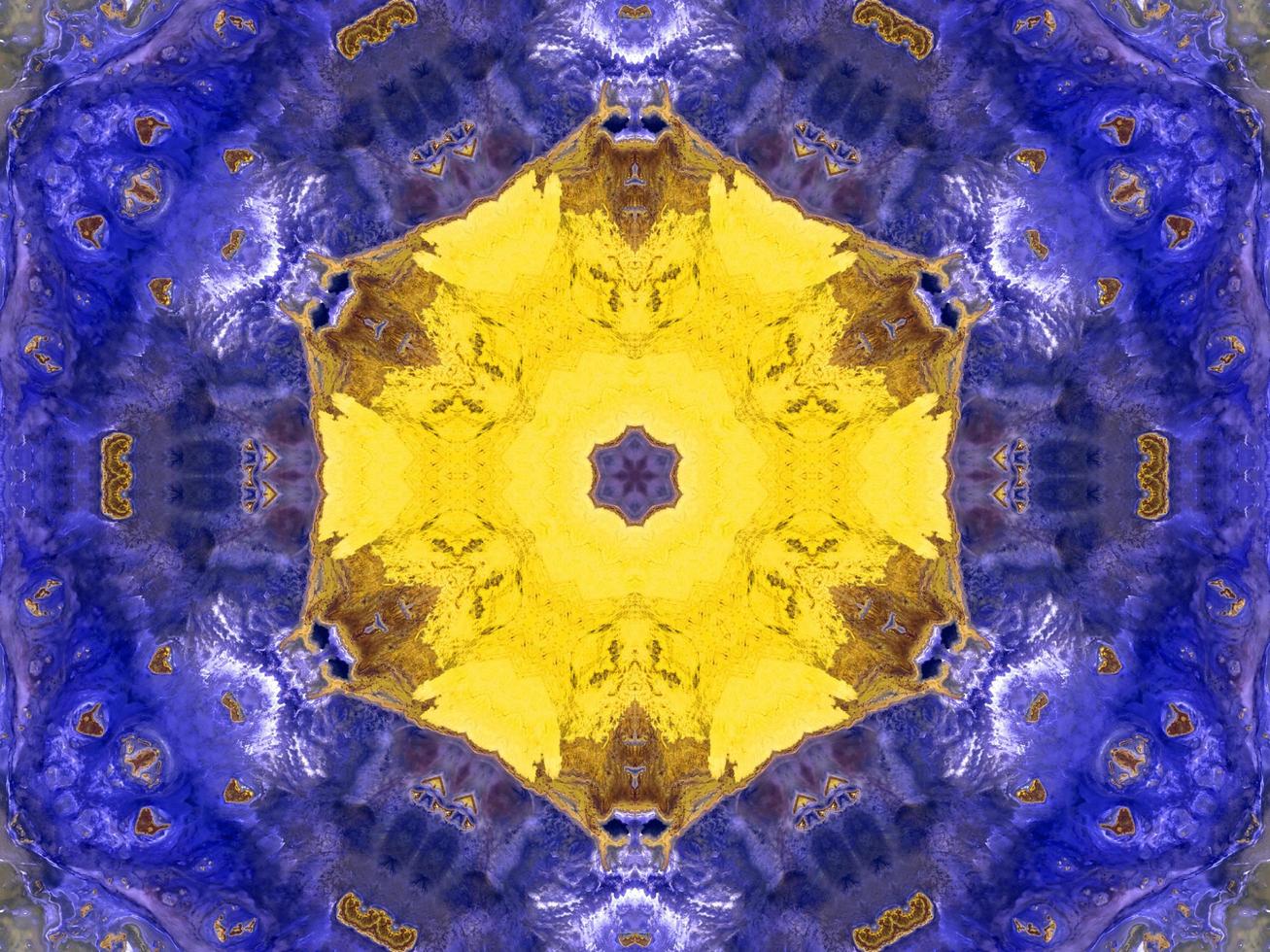 Reflection of colorful flowers in kaleidoscope pattern. Yellow and blue abstract background. Free photo. photo