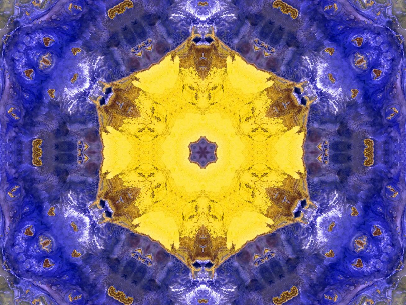 Reflection of colorful flowers in kaleidoscope pattern. Yellow and blue abstract background. Free photo. photo