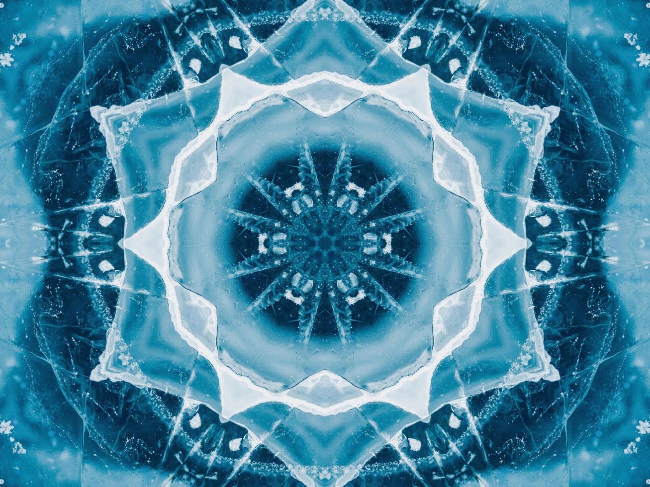 Reflection of deep blue sea in kaleidoscope pattern. Dark blue abstract background. Free photo. photo