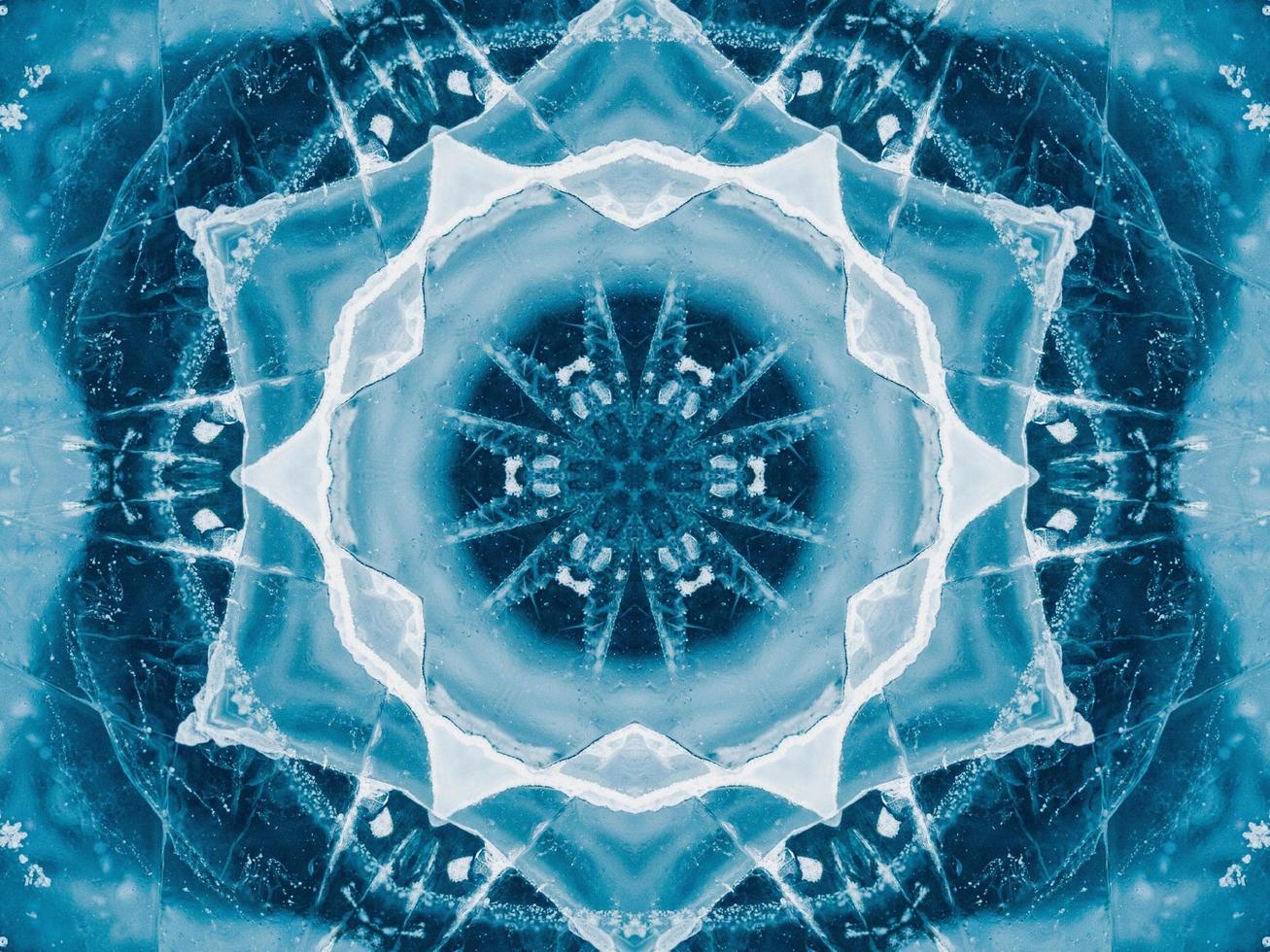 Reflection of deep blue sea in kaleidoscope pattern. Dark blue abstract background. Free photo. photo