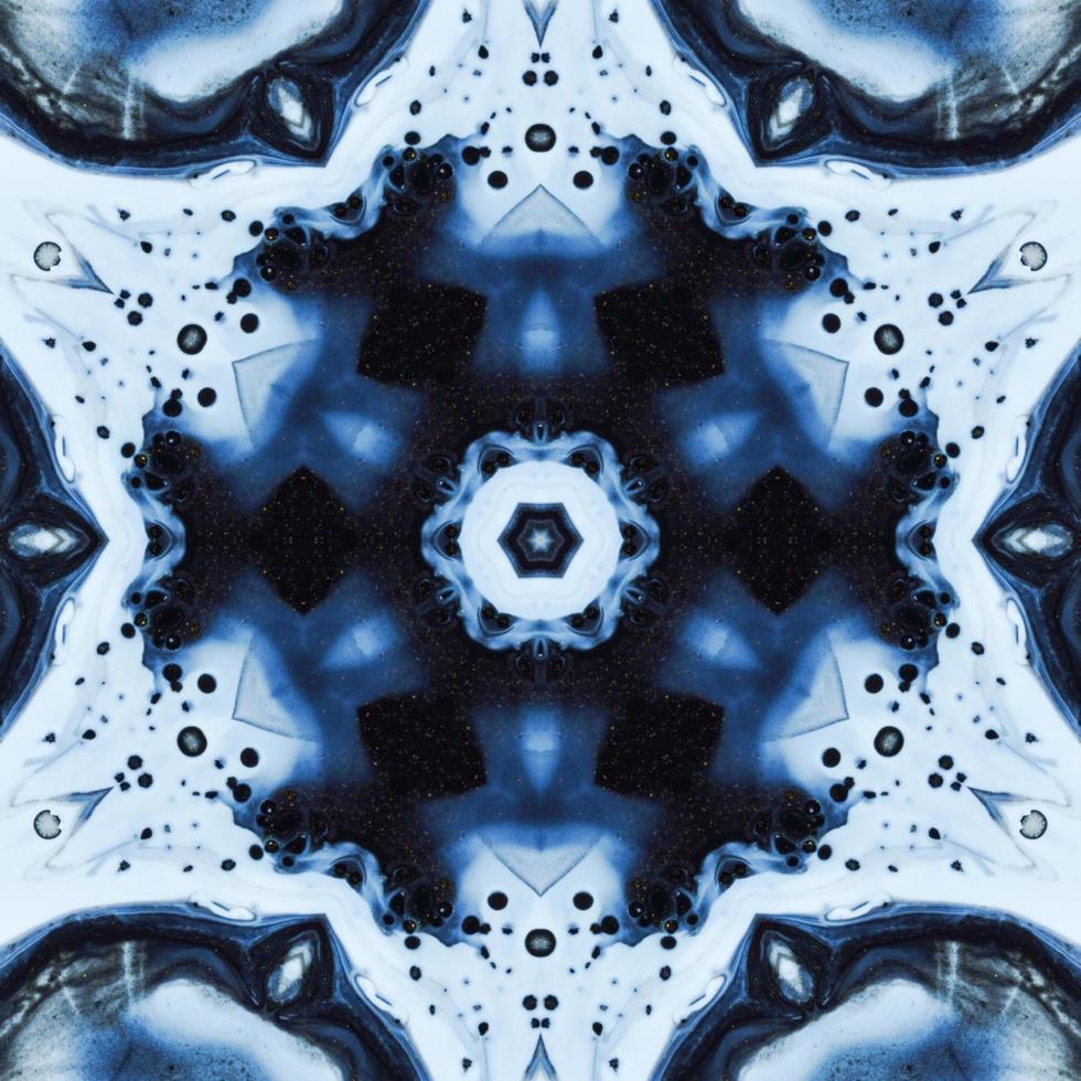 Dark reflection abstract background. Kaleidoscope pattern in black and blue color. Free photo. photo