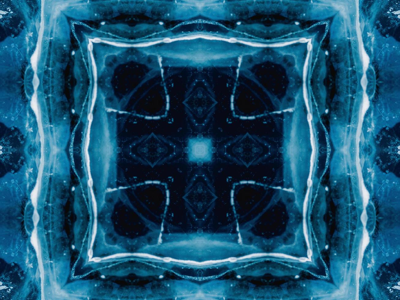 Reflection of deep blue sea in kaleidoscope pattern. Dark blue abstract background. Free photo. photo