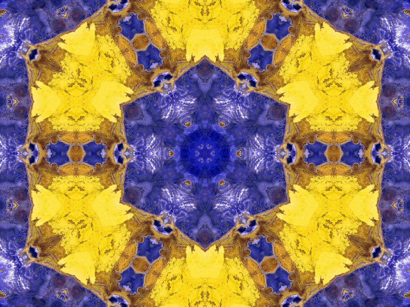 Reflection of colorful flowers in kaleidoscope pattern. Yellow and blue abstract background. Free photo. photo