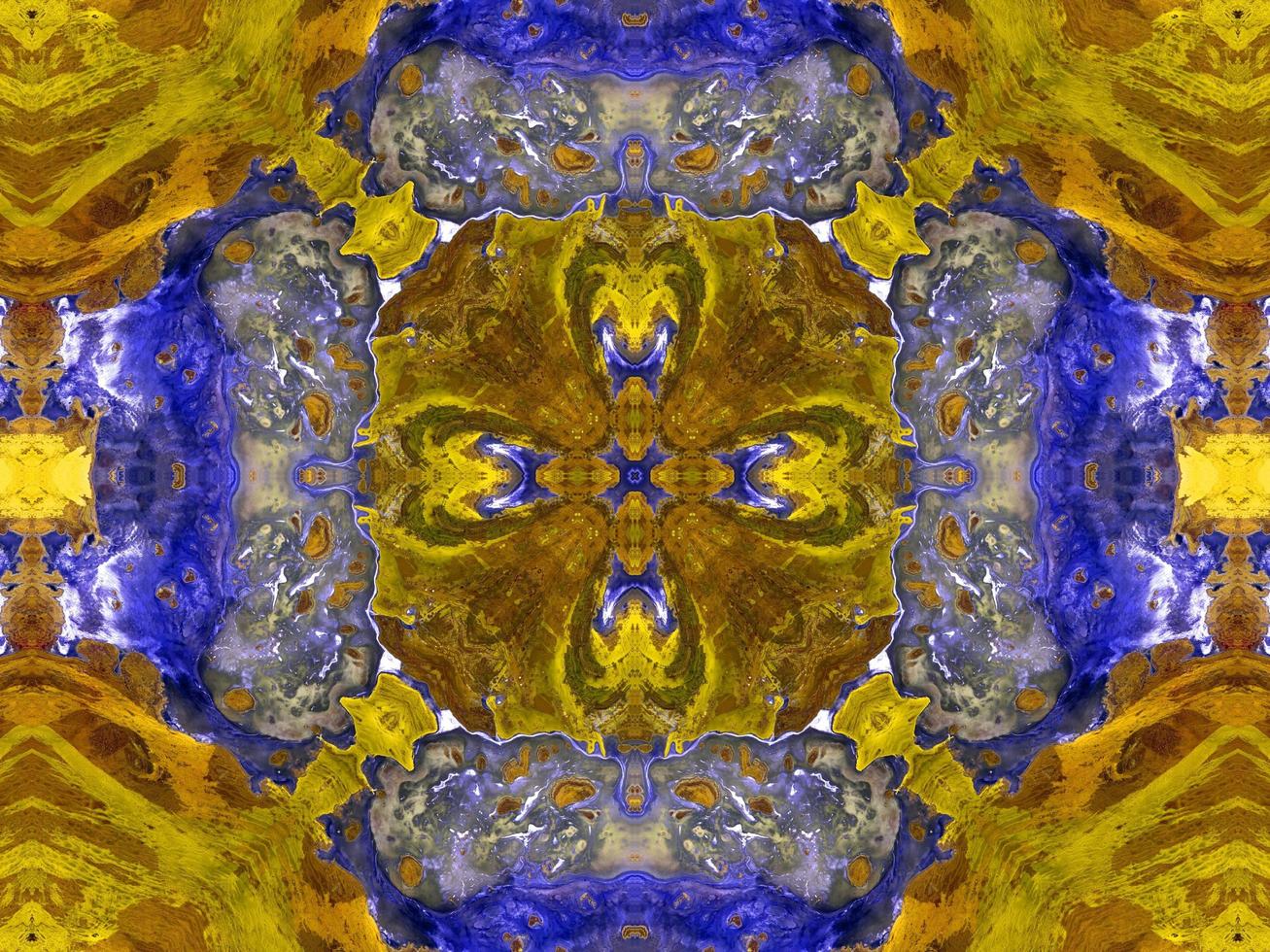 Reflection of colorful flowers in kaleidoscope pattern. Yellow and blue abstract background. Free photo. photo