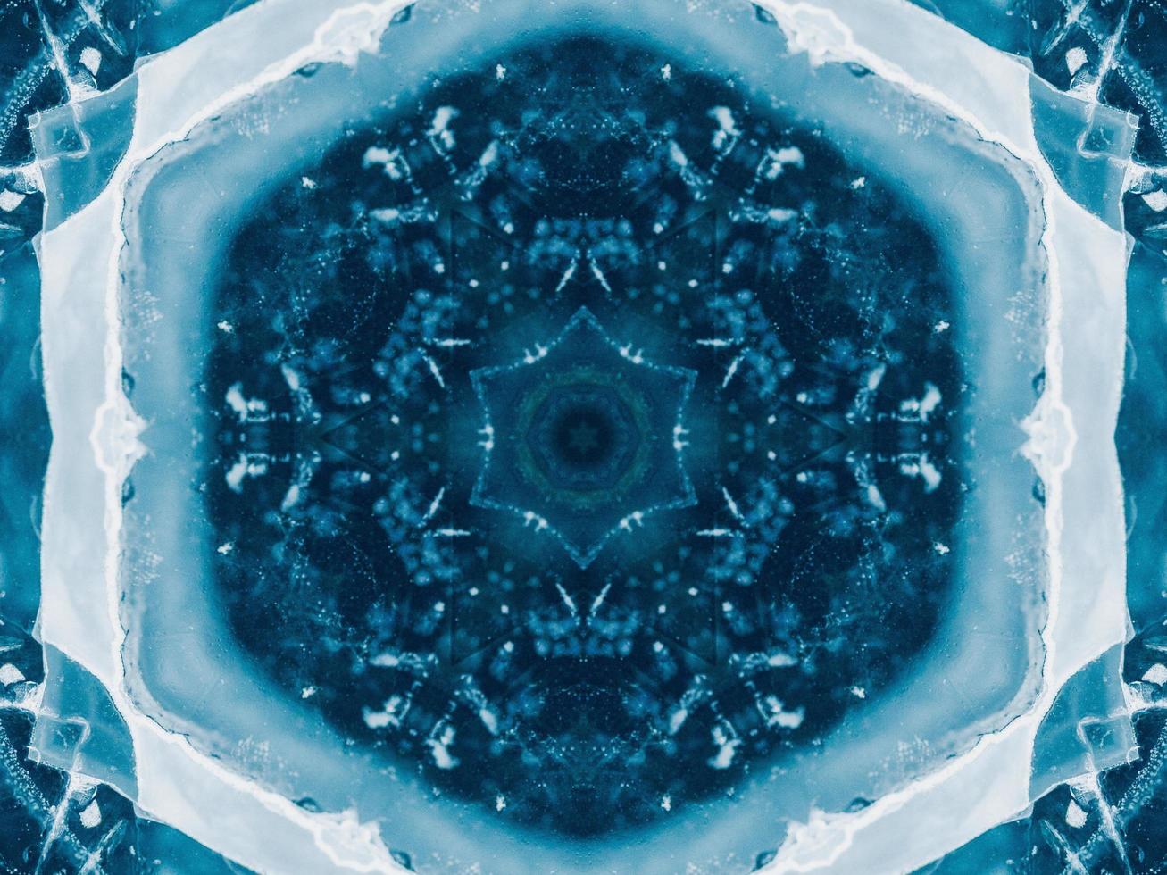 Reflection of deep blue sea in kaleidoscope pattern. Dark blue abstract background. Free photo. photo