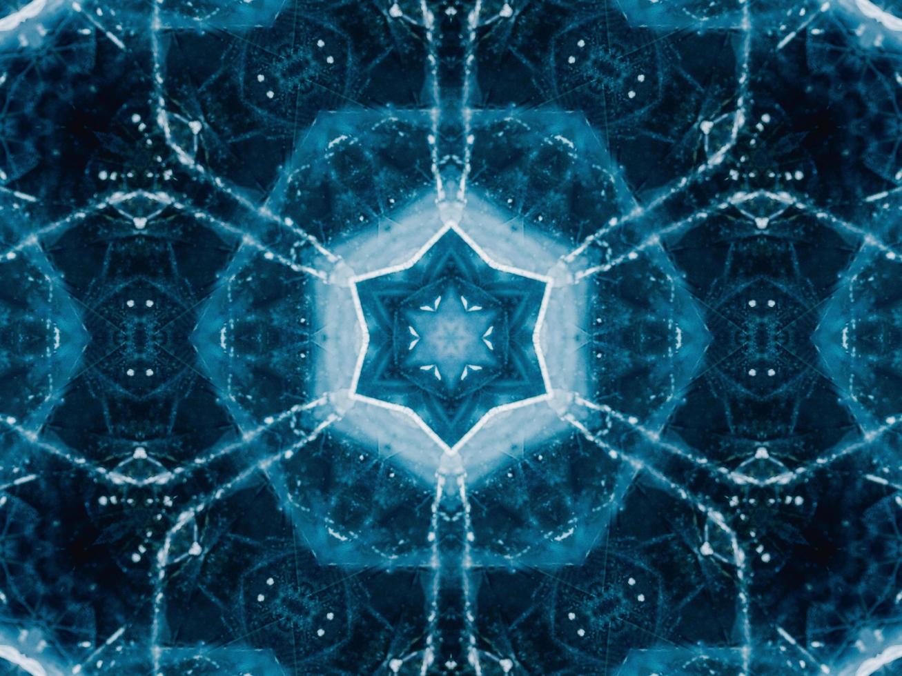 Reflection of deep blue sea in kaleidoscope pattern. Dark blue abstract background. Free photo. photo