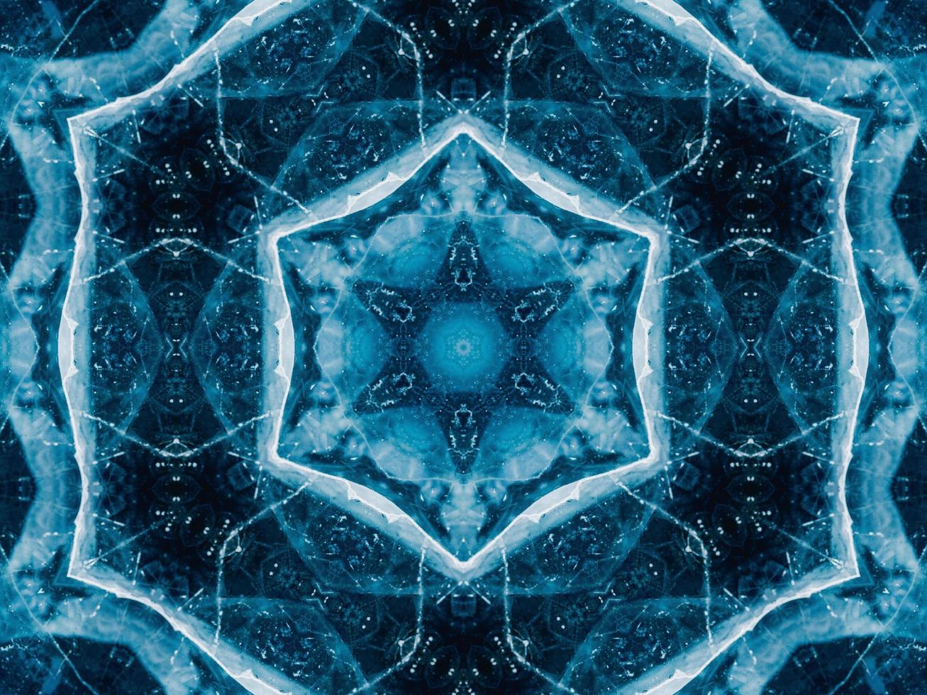 Reflection of deep blue sea in kaleidoscope pattern. Dark blue abstract background. Free photo. photo