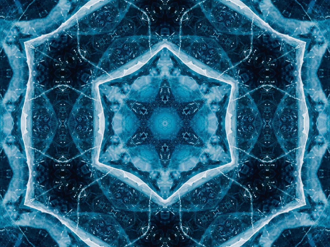 Reflection of deep blue sea in kaleidoscope pattern. Dark blue abstract background. Free photo. photo