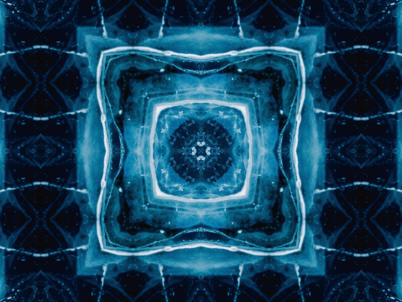 Reflection of deep blue sea in kaleidoscope pattern. Dark blue abstract background. Free photo. photo