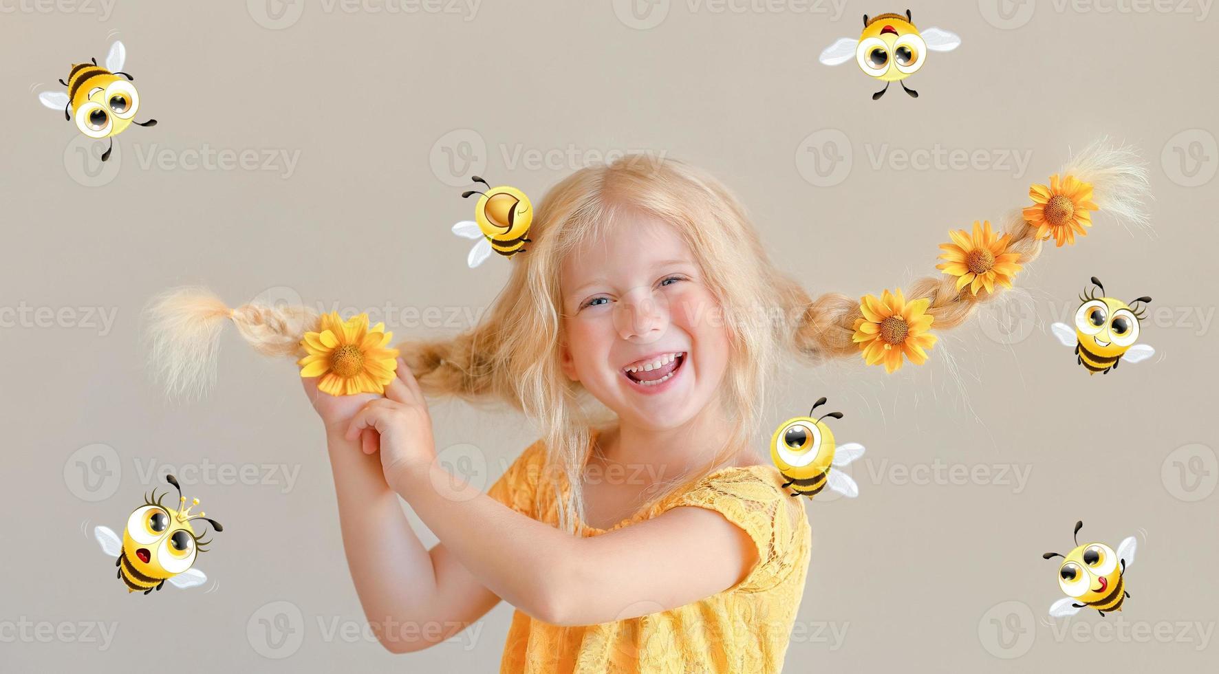 Laughing girl with yellow flowers in braids and cartoon bee photo