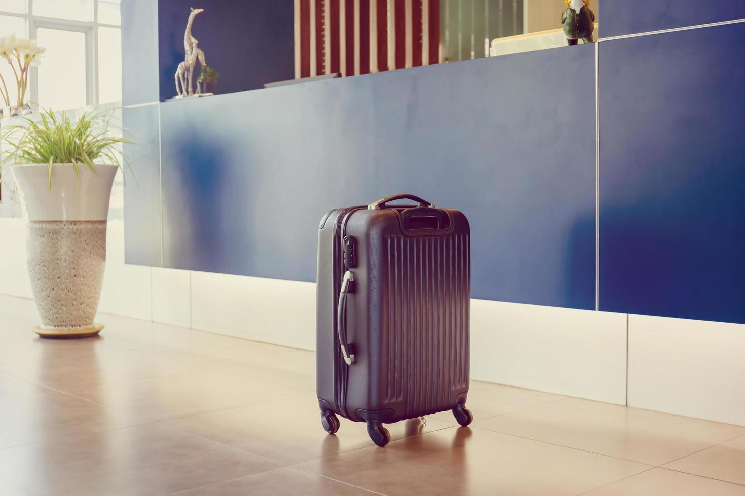 Suitcases at the front desk hotel reception, Bag travel luggage at the ...