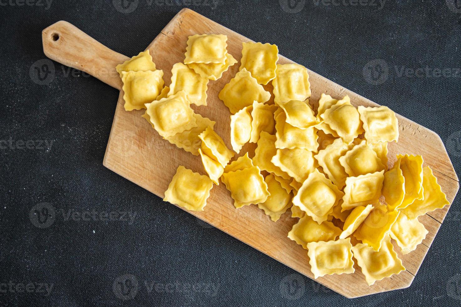 ravioli pasta stuffed square shape italian dish fresh healthy meal food snack diet on the table copy space food photo