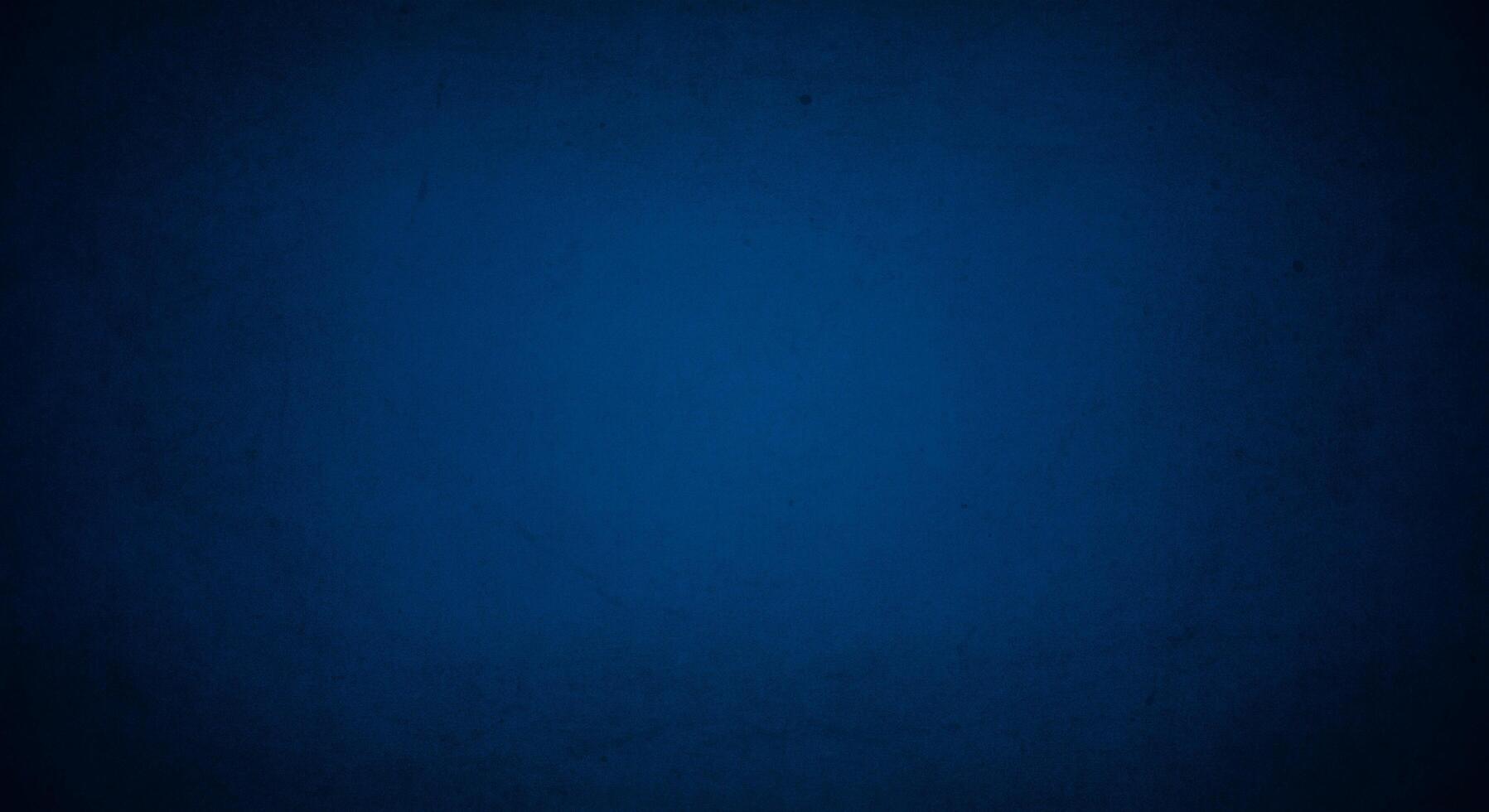 dark blue grunge background with soft lightand dark border, old vintage background photo