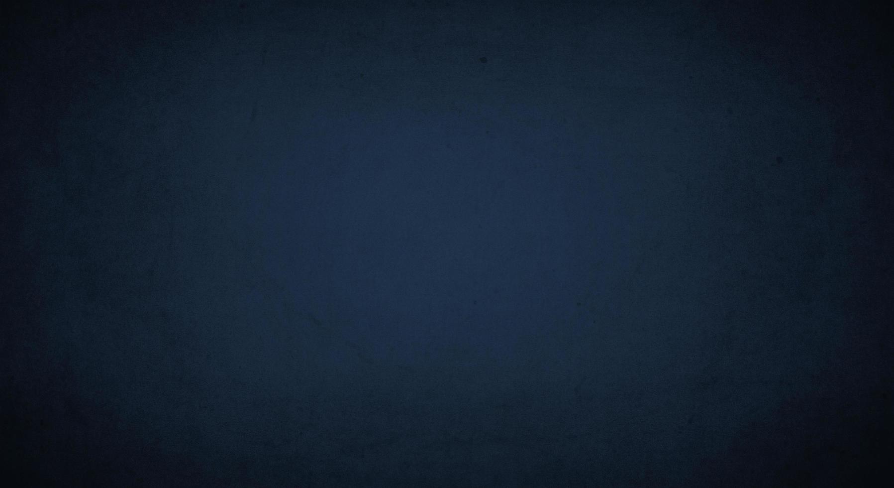 dark blue grunge background with soft lightand dark border, old vintage background photo