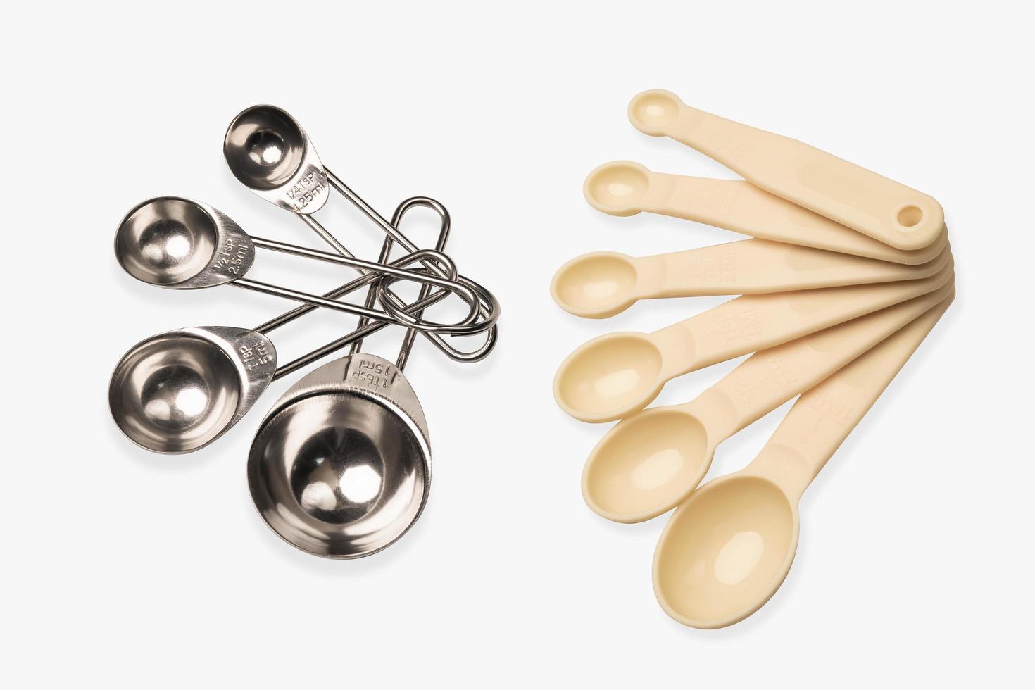 measuring spoon on white background ,Measuring spoons made of plastic or metal and many sizes . photo