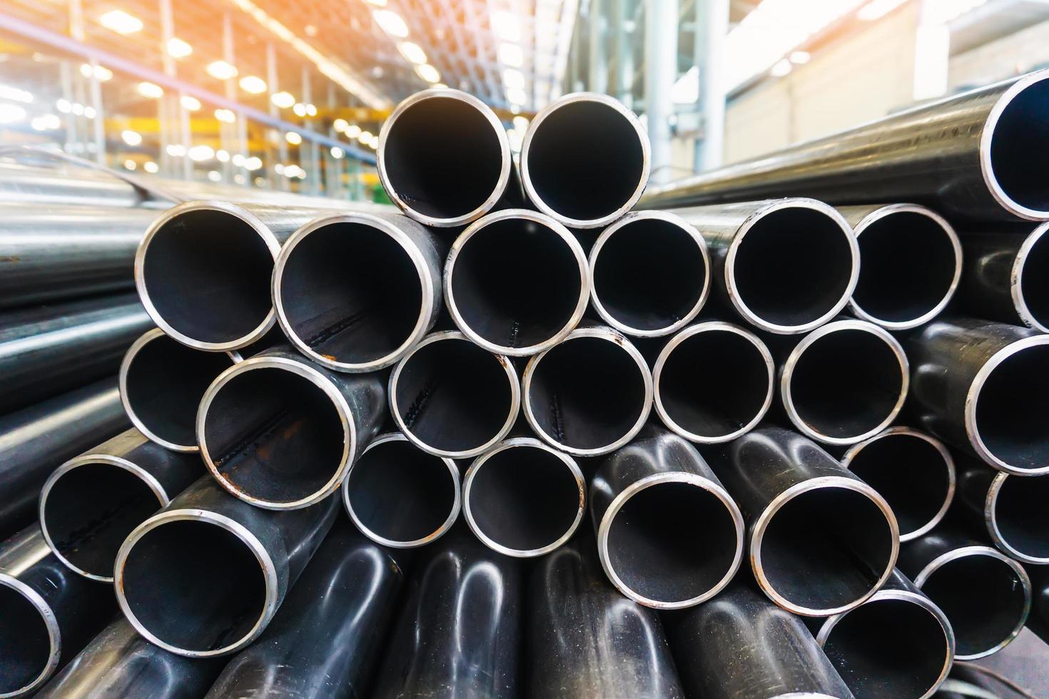 high quality Galvanized steel pipe or Aluminum and chrome stainless pipes in stack waiting for shipment  in warehouse photo