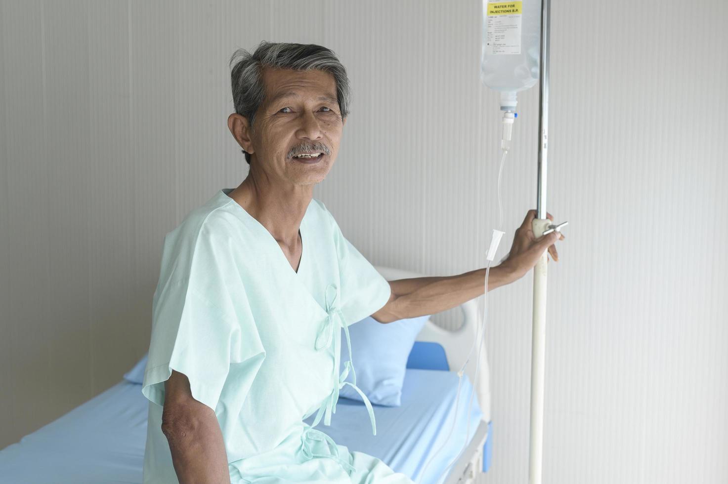 Portrait of senior patient lying on bed in hospital, healthcare and medical concept photo