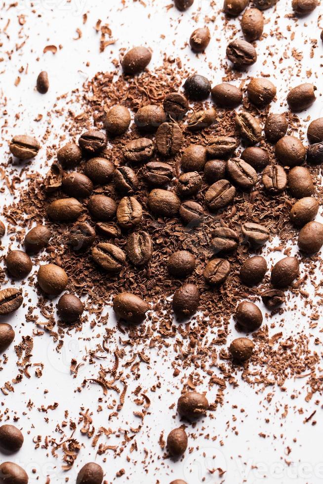 Coffee beans and particles of black chocolate photo