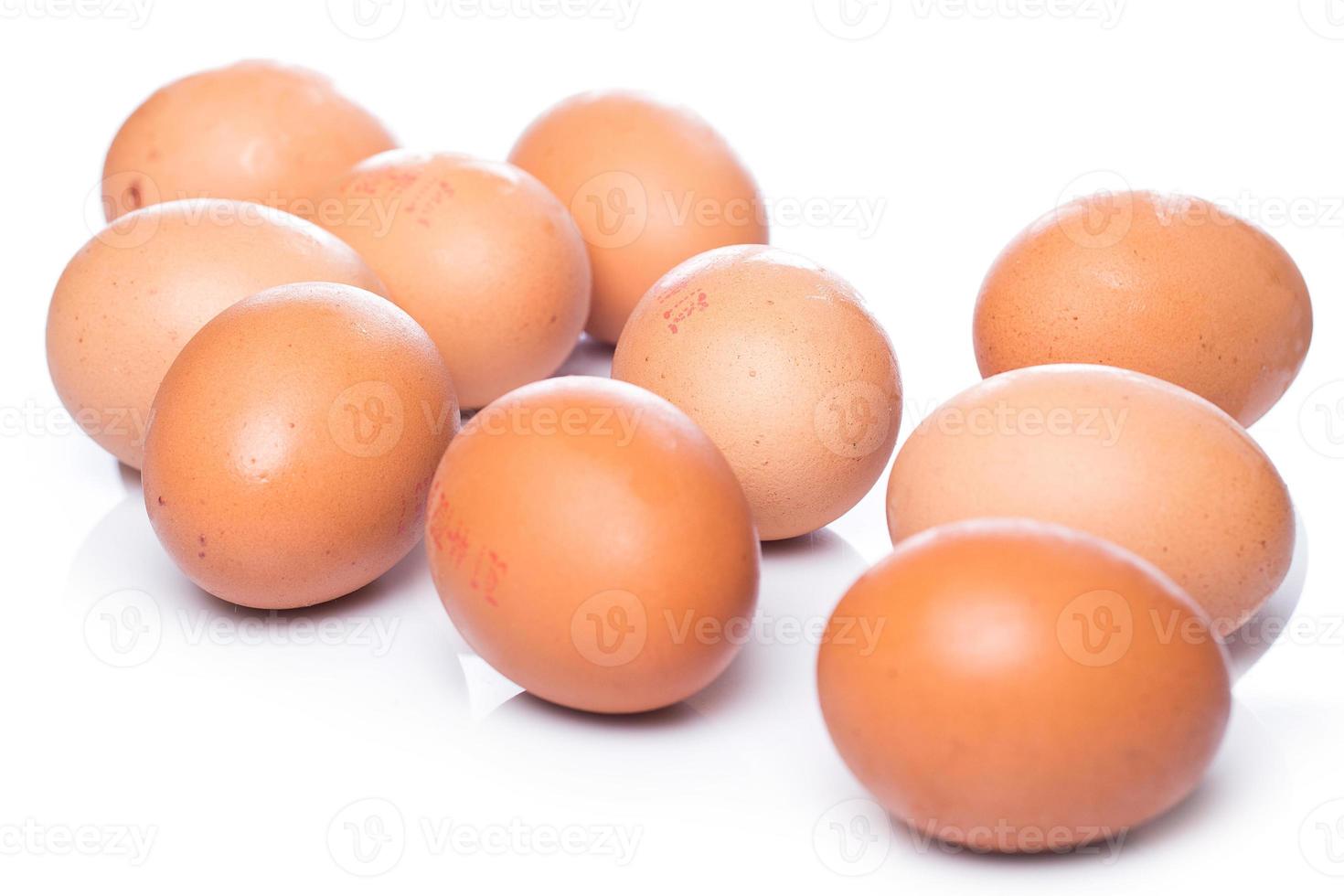 Brown eggs on white background photo