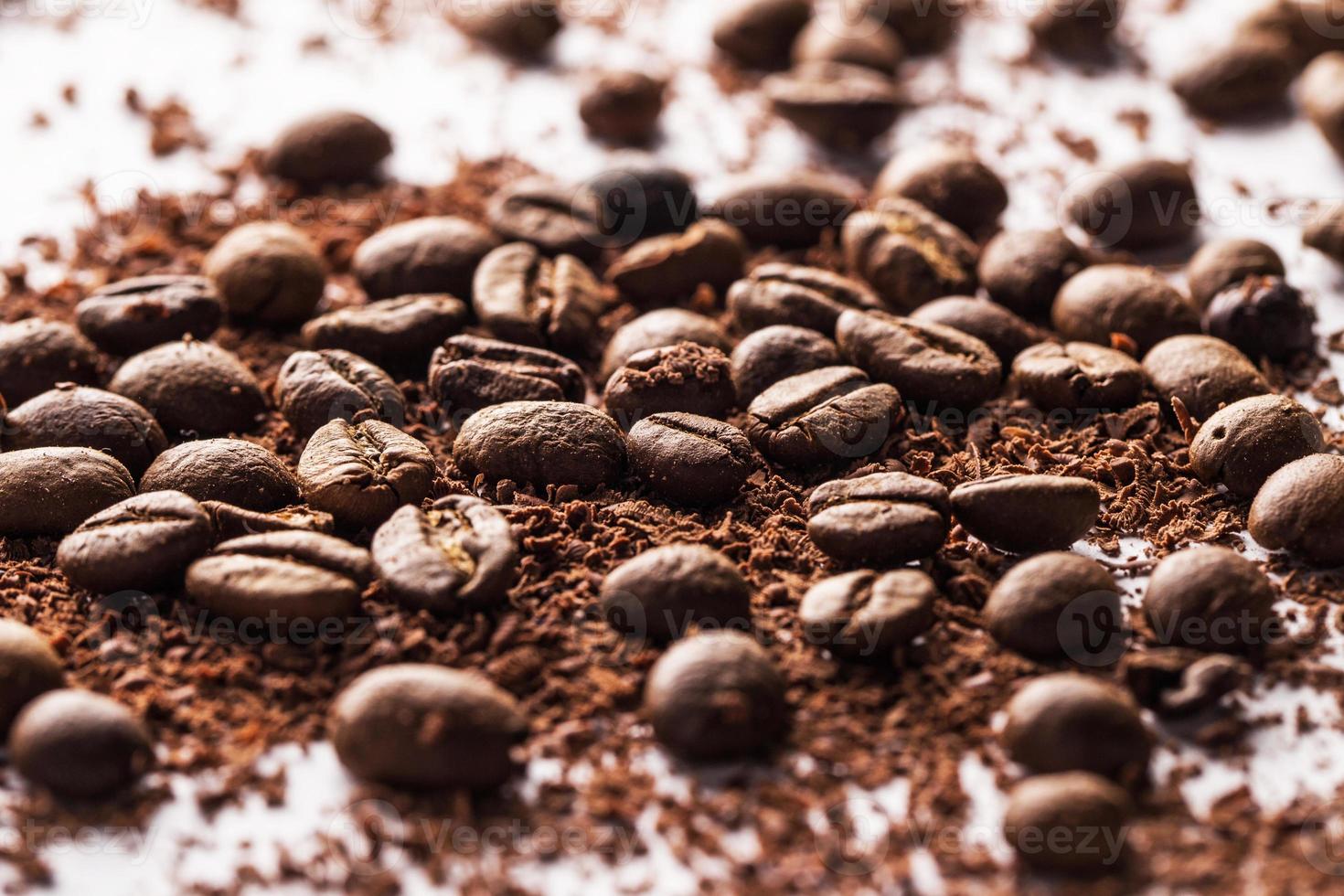 Coffee beans and particles of black chocolate photo