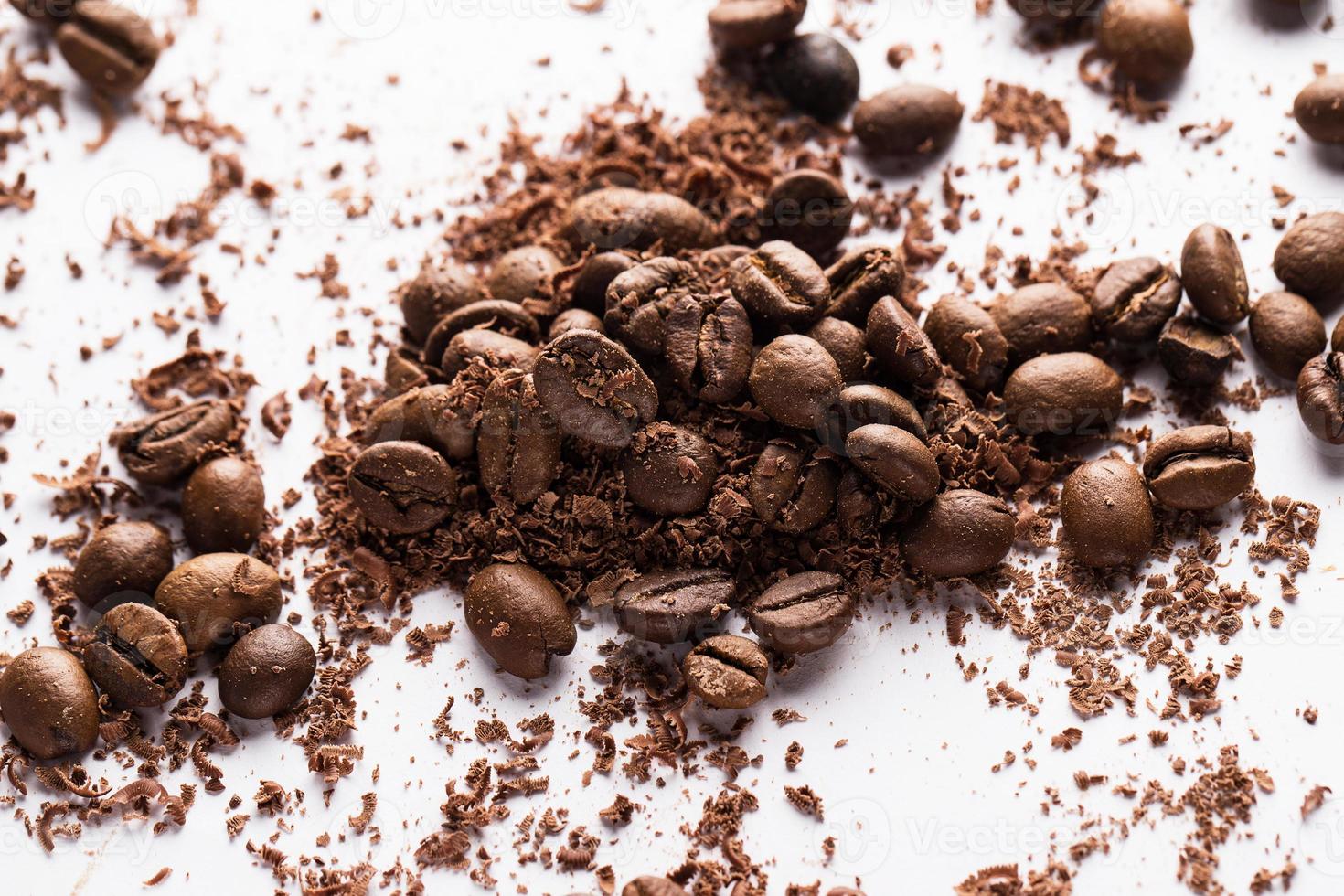Coffee beans and particles of black chocolate photo