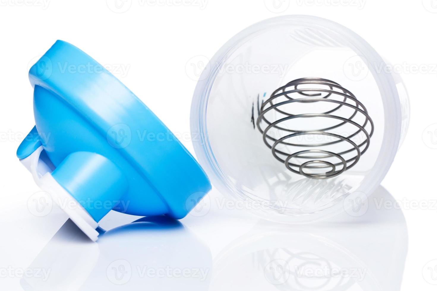 Empty protein shaker with metallic ball photo