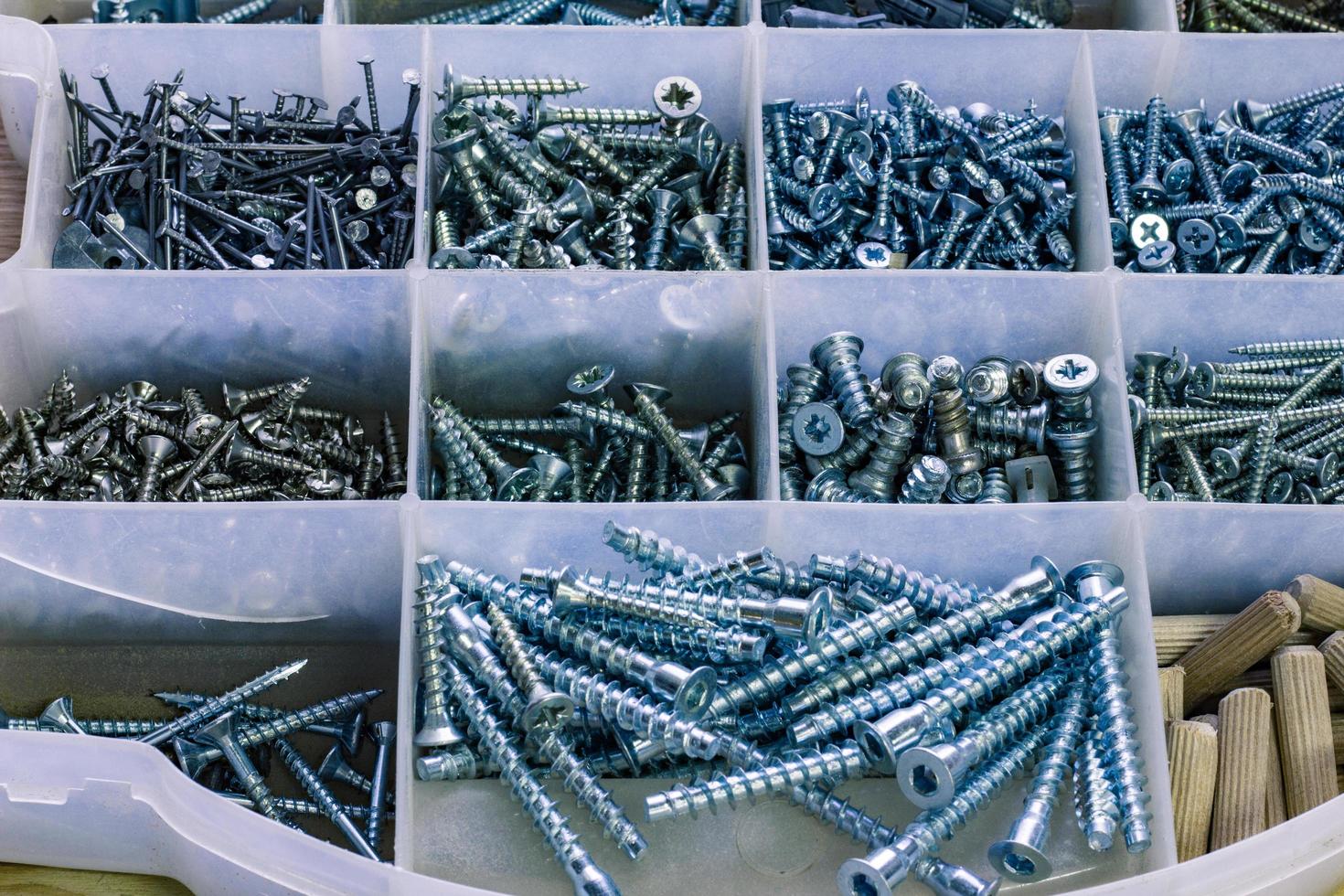 box of carpenter with many screws photo
