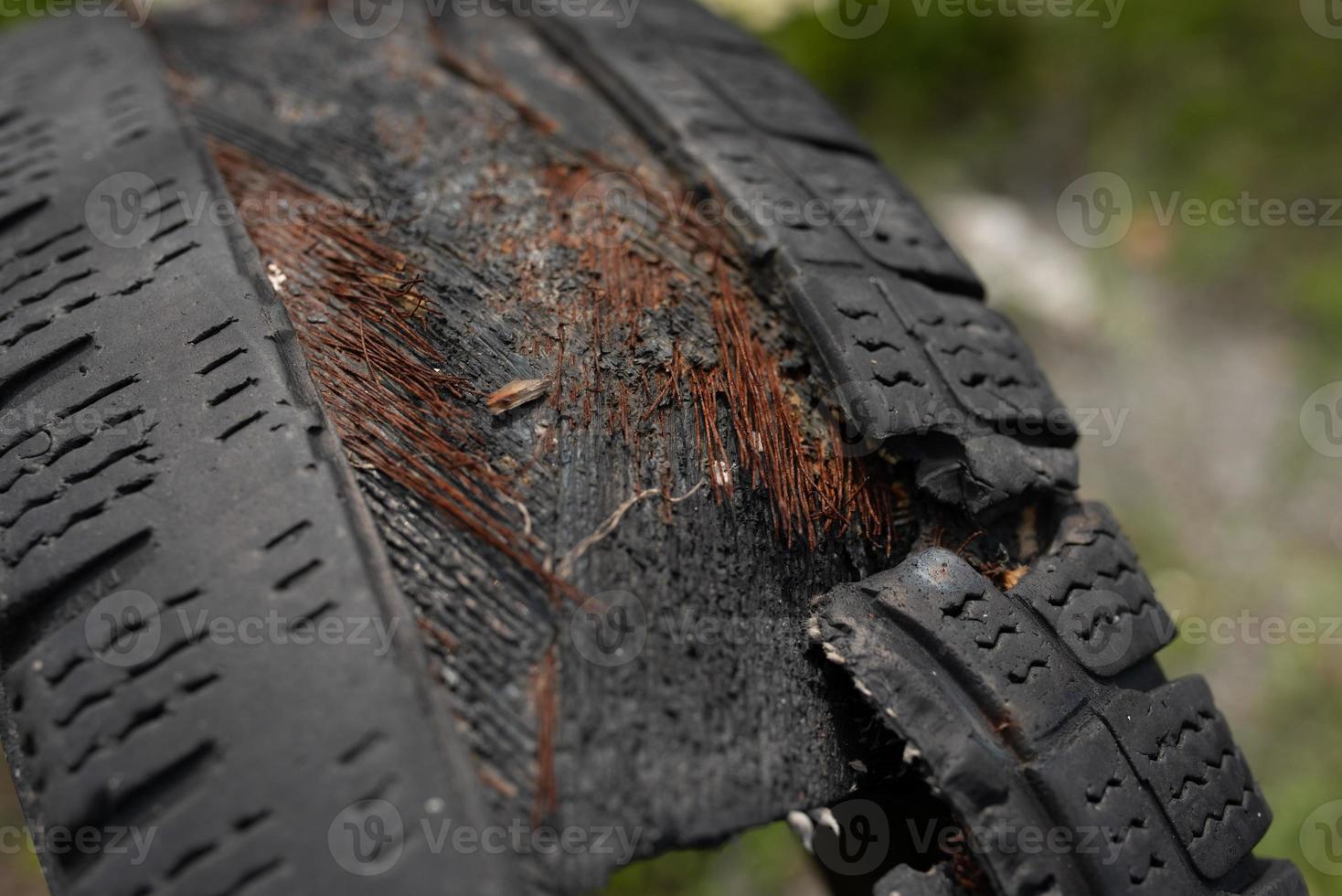 Old black car tires. Unauthorized dump. photo