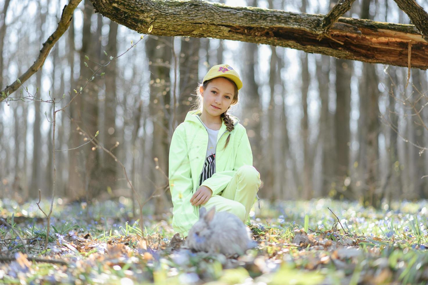 Little girl with a rabbit photo