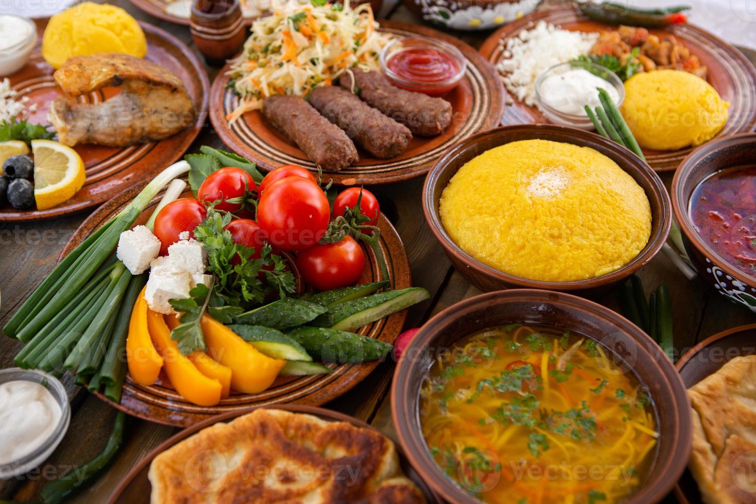 Homemade Romanian Food with pies, polenta, borscht, vegetables, fish