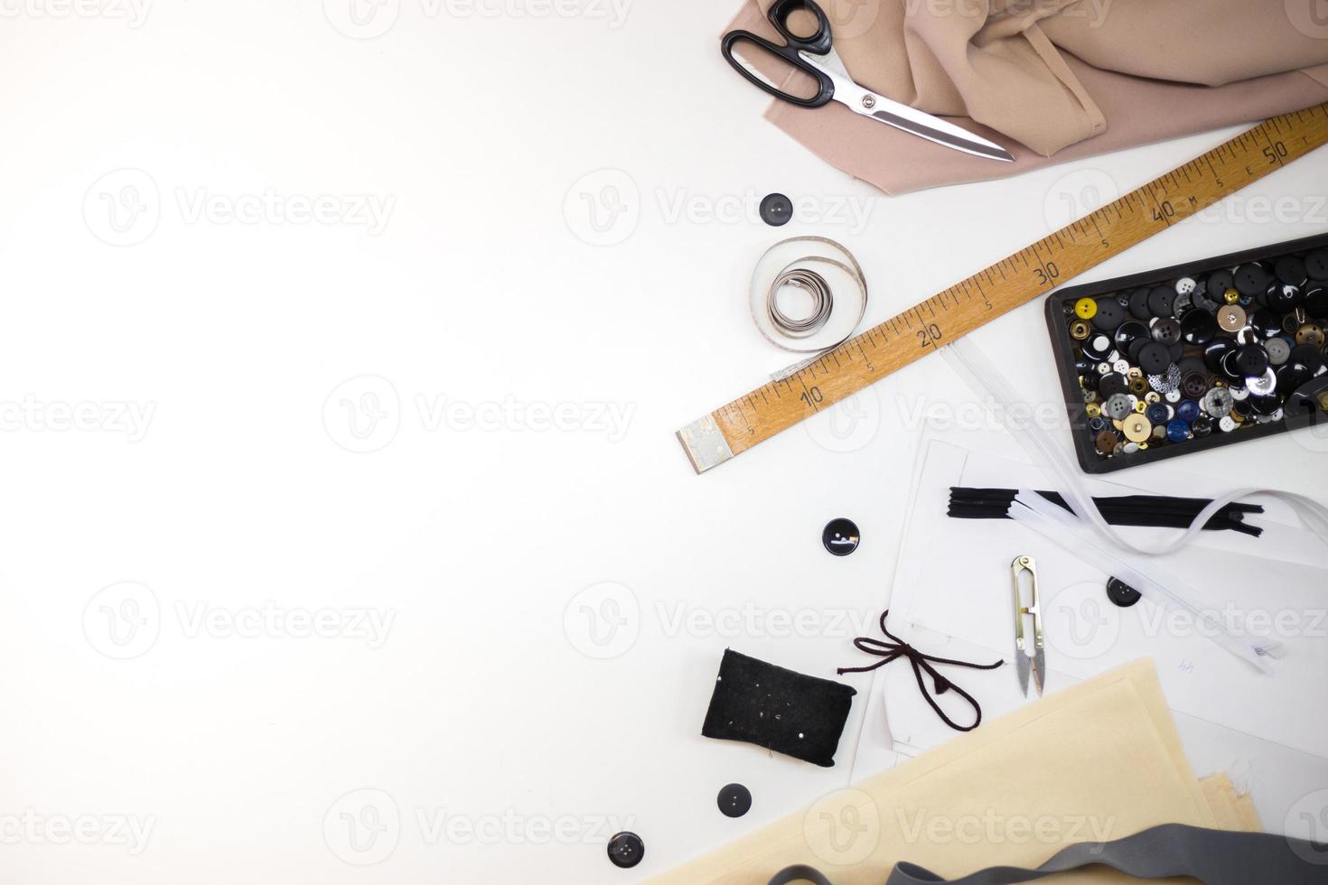 Sewing accessories and fabric on a white background. photo