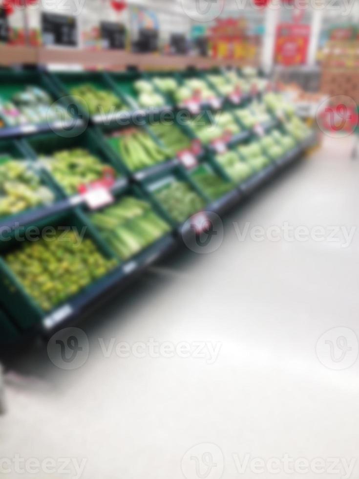 Vegetables and fruit on shelf in supermarket blurred background photo
