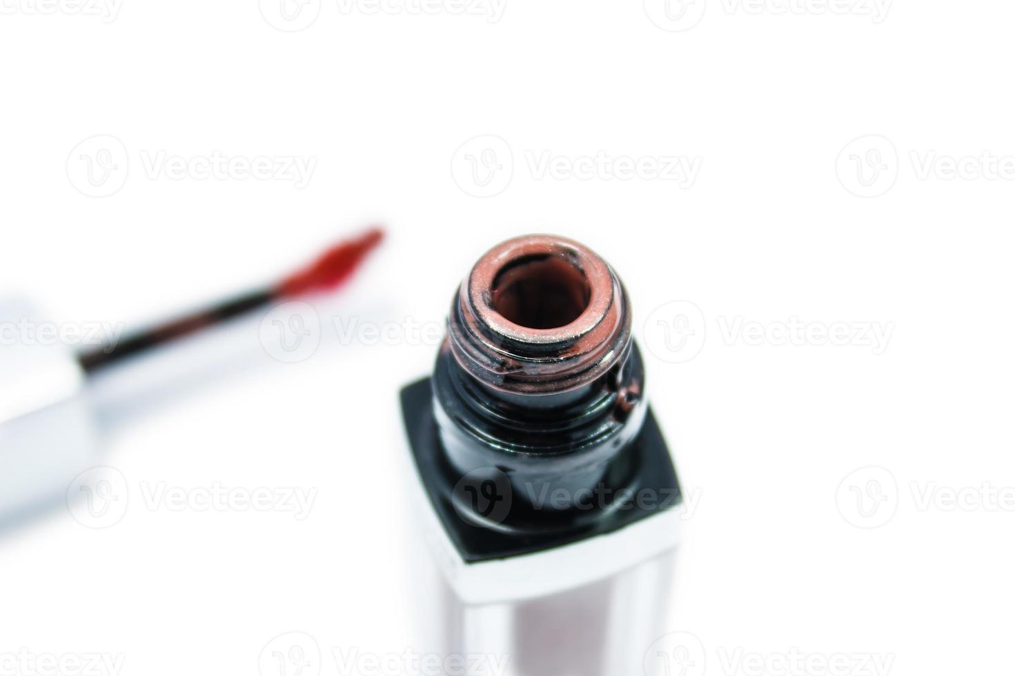 Lip gloss isolated on a white background photo