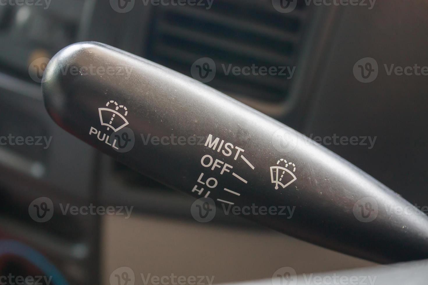 Closeup of car wiper control, modern car interior details photo