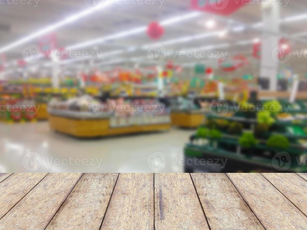wood counter product display with fruits shelves in supermarket blurred background photo