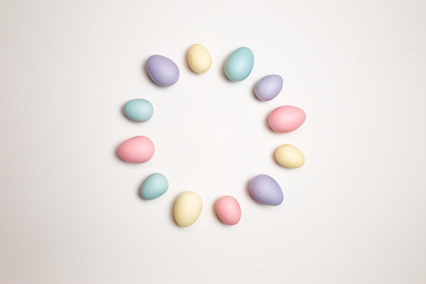 Pastel colored Easter eggs on a white background photo