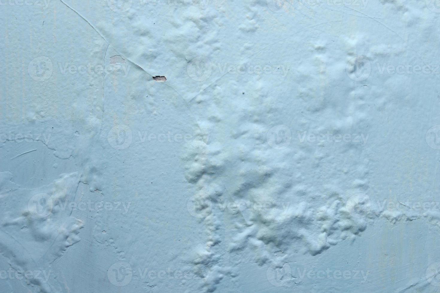 blue paint is peeling off texture the building wall photo