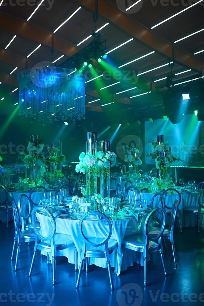 Table setup in blue light. Ready to event. photo