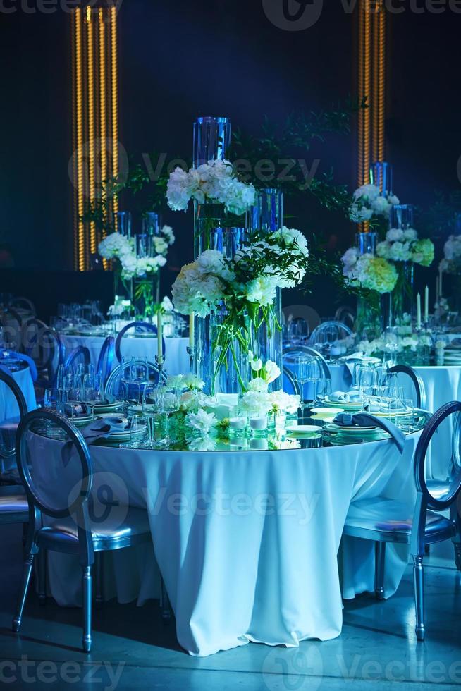 Table setup in blue light. Ready to event photo