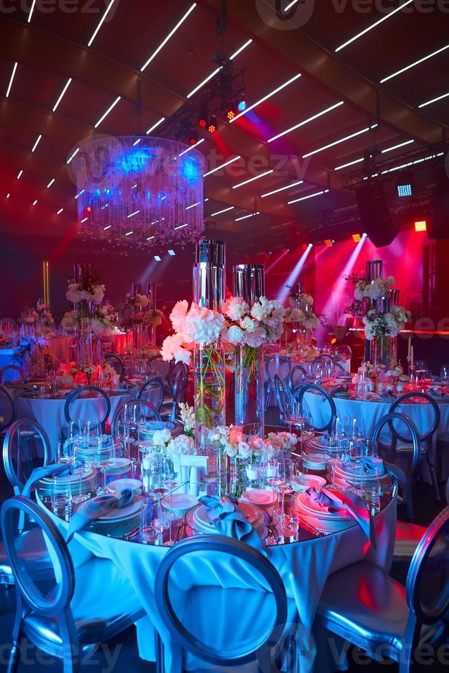 Table setup in red light. Ready to event. Shallow dof. photo
